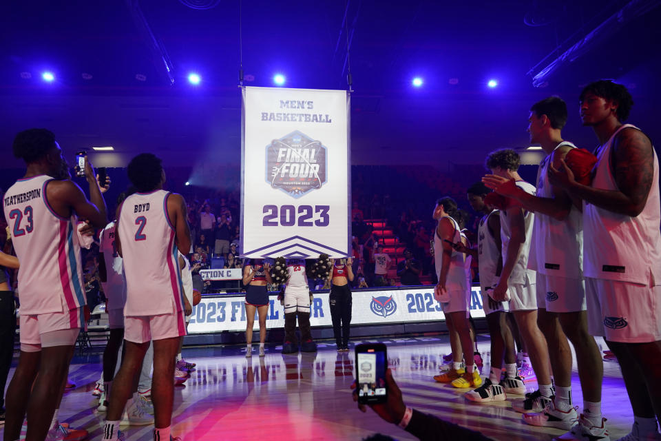 FAUY players watch as the Final Four banner is raised during a Paradise Madness ceremony for the NCAA college basketball team Wednesday, Oct. 25, 2023, in Boca Raton, Fla. (AP Photo/Lynne Sladky)