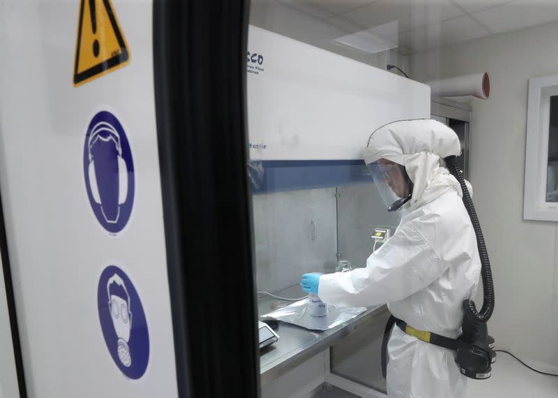 Jerome Bodart, PhD student at the Greenmat laboratory of the University of Liege is seen during a demonstration for the media amid the coronavirus disease (COVID-19) outbreak in Liege