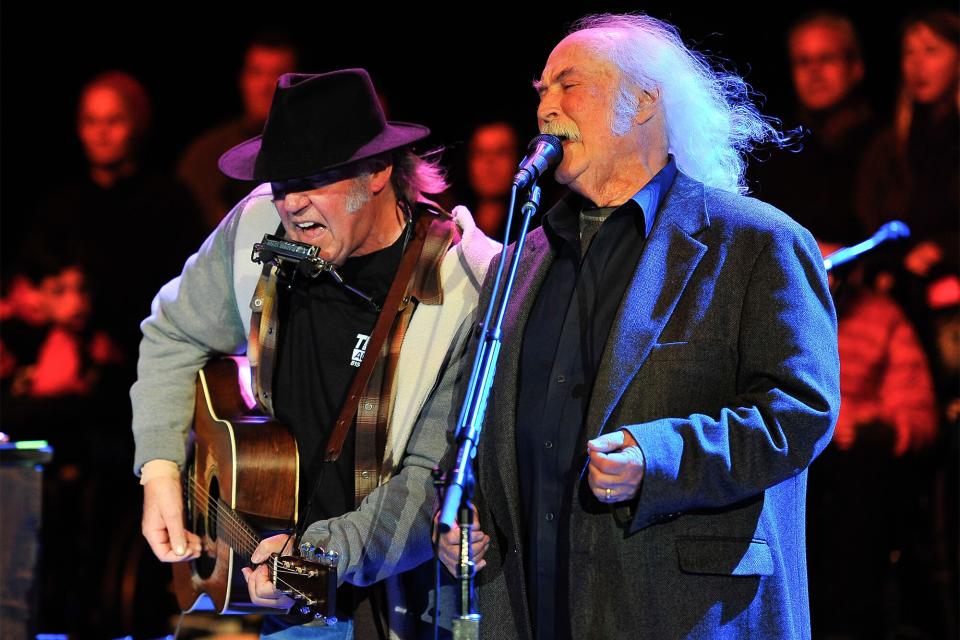 Neil Young and David Crosby (L-R) perform on Day 2 of the 27th Annual Bridge School Benefit concert at Shoreline Amphitheatre on October 27, 2013 in Mountain View, California.