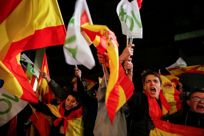 Supporters of Spain's far-right party VOX react during Spain's general election, outside the party headquarters in Madrid