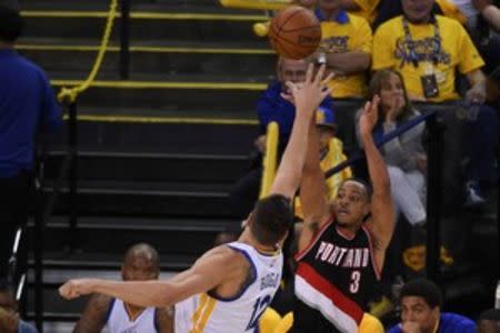 May 1, 2016; Oakland, CA, USA; Portland Trail Blazers guard C.J. McCollum (3) shoots the basketball against Golden State Warriors center Andrew Bogut (12) during the fourth quarter in game one of the second round of the NBA Playoffs at Oracle Arena.Kyle Terada-USA TODAY Sports