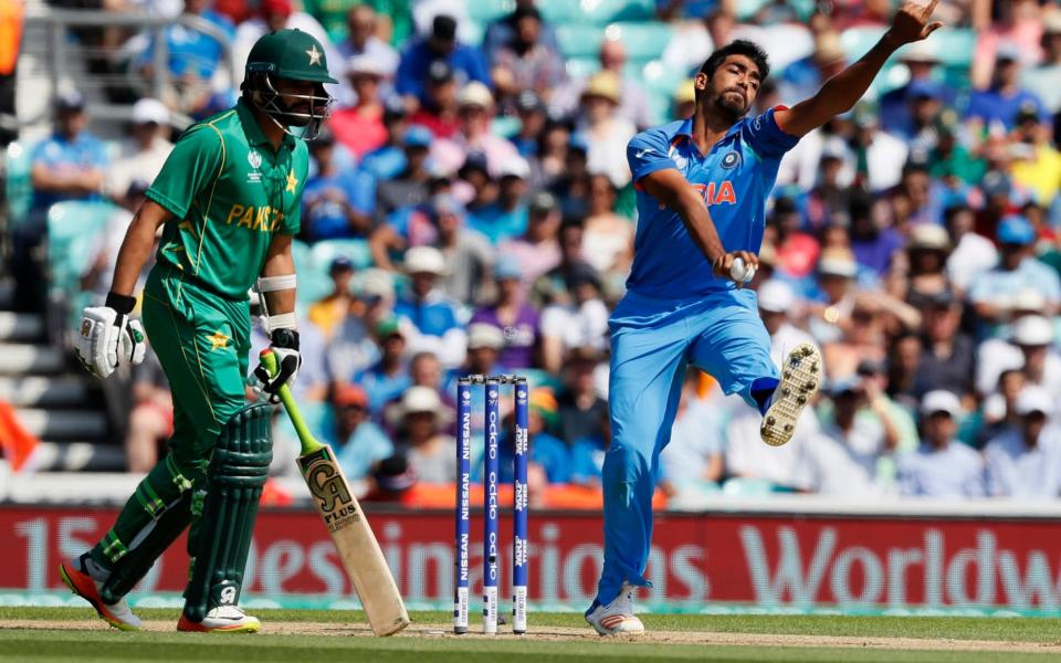 India's Jasprit Bumrah, right, bowls - Credit: AP