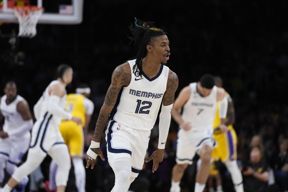 Memphis Grizzlies' Ja Morant celebrates after his 3-point basket during the first half in Game 4 of a first-round NBA basketball playoff series against the Los Angeles Lakers, Monday, April 24, 2023, in Los Angeles. (AP Photo/Jae C. Hong)