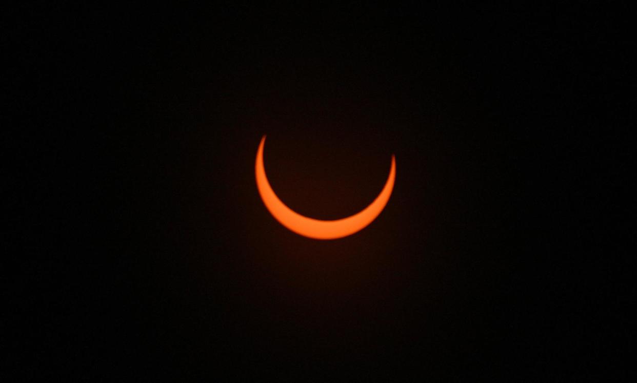 <span>The moon crosses in front of the sun in Albuquerque, New Mexico on 14 October 2023.</span><span>Photograph: Sam Wasson/Getty Images</span>