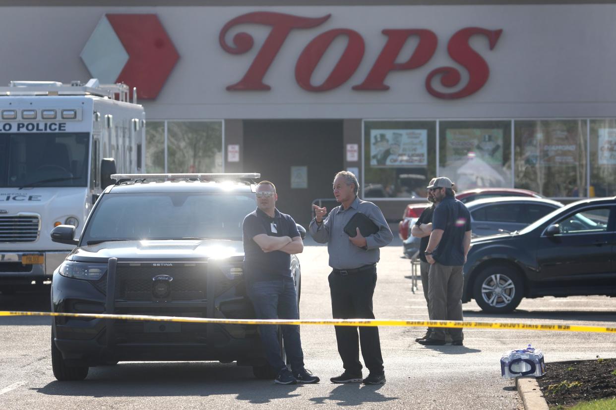 Police continue investigating at Tops market on May 15, 2022 in Buffalo, New York.