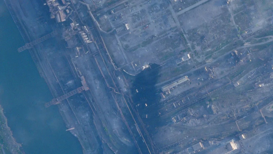 This satellite image taken by Planet Labs PBC shows smoke rising at the Azovstal steelworks in Mariupol, Ukraine, Wednesday, May 4, 2022. Russian forces began storming the bombed-out steel mill in Mariupol on Tuesday, May 3, 2022. The renewed push to take the mill came after scores of civilians were evacuated from the plant's underground tunnels after enduring weeks of shelling. (Planet Labs PBC via AP)