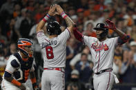 Atlanta Braves' Jorge Soler celebrates a three-run home run with Eddie Rosario during the third inning in Game 6 of baseball's World Series between the Houston Astros and the Atlanta Braves Tuesday, Nov. 2, 2021, in Houston. (AP Photo/David J. Phillip)