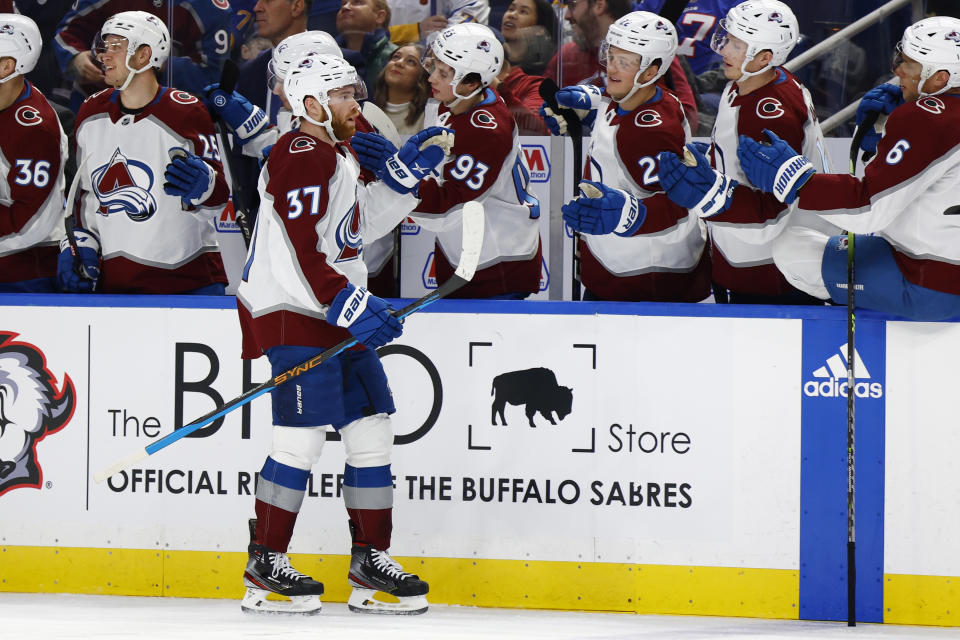 Colorado Avalanche left wing J.T. Compher (37) celebrates after his goal during the first period of an NHL hockey game against the Buffalo Sabres, Thursday, Dec. 1, 2022, in Buffalo, N.Y. (AP Photo/Jeffrey T. Barnes)