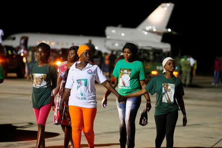Supporters of former Gambia's President Yahya Jammeh are seen on the tarmac at the Banjul International Airport, Gambia January 21, 2017. REUTERS/Afolabi Sotunde