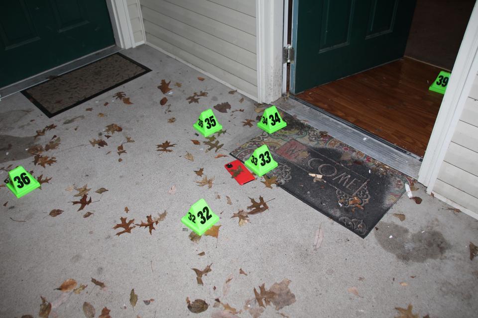 In this crime scene evidence photo released by the Louisville Metro Police Department, Louisville Police marked shell casings are seen at the front door of Breonna Taylor's apartment after she was fatally shot by police in Louisville, Ky., on March 13, 2020. The Kentucky Attorney General said in October that two long rifle shell casings were also found at the scene after the police raid that killed Taylor. (Louisville Metro Police Department via AP)