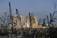 Damaged structures are visible at the site of an explosion on Tuesday that hit the seaport of in Beirut, Lebanon, Thursday, Aug. 6, 2020. Lebanese officials targeted in the investigation of the massive blast that tore through Beirut sought to shift blame for the presence of explosives at the city's port, and the visiting French president warned that without serious reforms the country would "continue to sink." (AP Photo/Hassan Ammar)