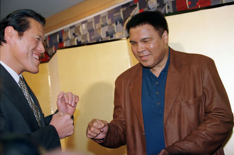 MUHAMMAD ALI POSES WITH JAPANESE PROWRESTLER INOKI IN TOKYO