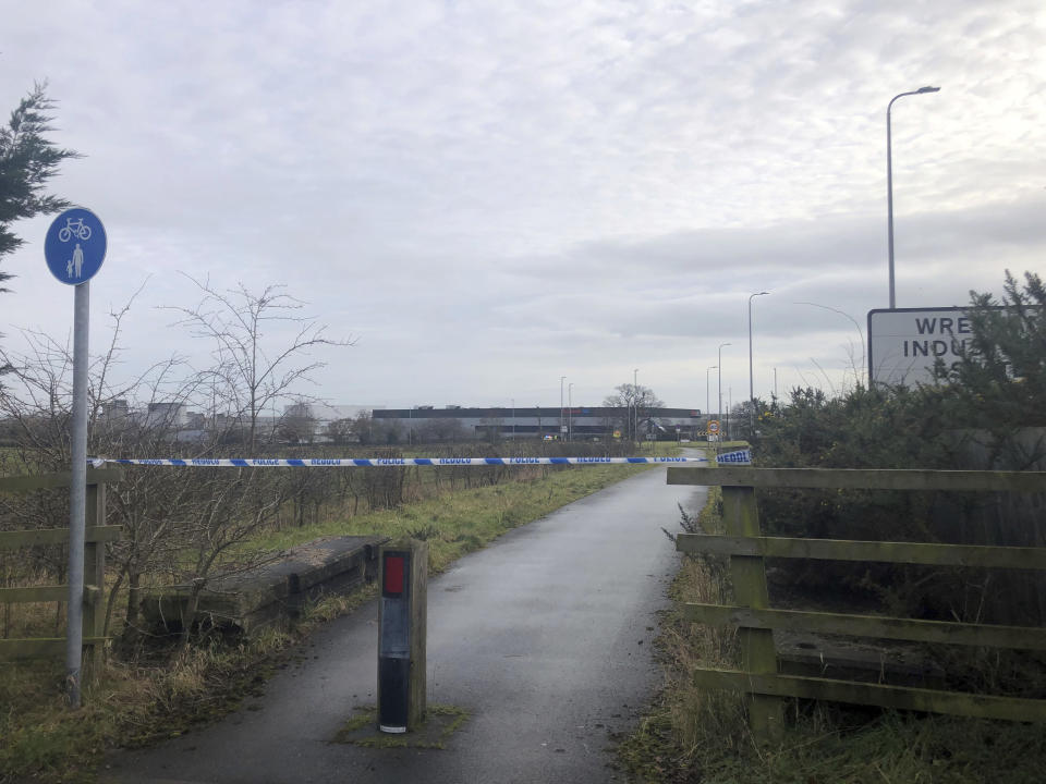 A police cordon at Wrexham Industrial Estate near the British pharmaceutical manufacturing company Wockhardt in Wrexham, north Wales, Wednesday Jan. 27, 2021. Wockhardt UK, an arm of the Mumbai-based pharmaceutical company that is producing the Oxford-AstraZeneca vaccine in north Wales, said it notified authorities after receiving a suspect package on Wednesday morning. (Eleanor Barlow/PA via AP)