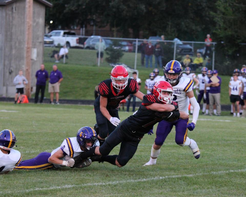 Clinton's Cole Breitenwischer lunges ahead for a score while Blissfield's Trey Bris-Bois tries to bring him down during a game earlier in the 2023 season.