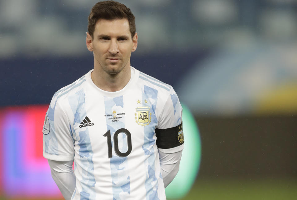 Argentina's Lionel Messi lines up prior to a Copa America soccer match against Bolivia at Arena Pantanal stadium in Cuiaba, Brazil, Monday, June 28, 2021. With Messi's start in today's match against Bolivia he has become the Argentina player with the most caps with his national team, surpassing Javier Mascherano. (AP Photo/Andre Penner)