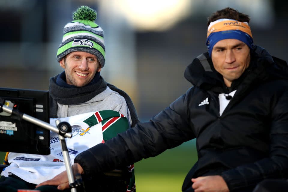 Ex-Leeds Rhinos rugby league player Kevin Sinfield (R) embraces former teammate Rob Burrow after completing his Extra Mile Challenge at Emerald Headingley Stadium on November 23, 2021 in Leeds, England. (Photo by George Wood/Getty Images)