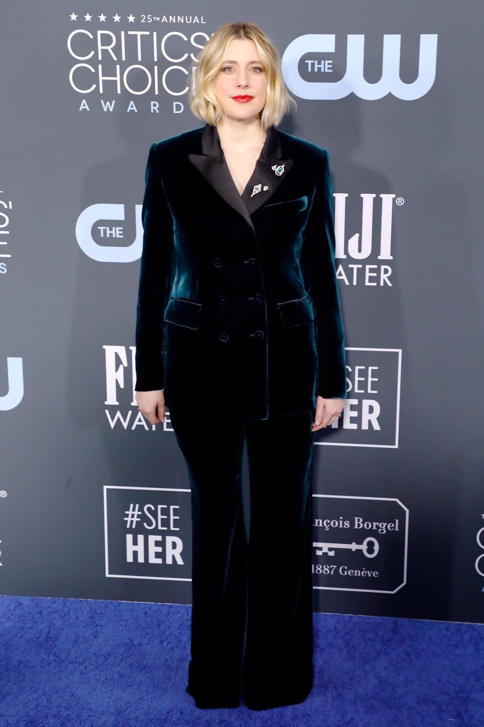 <p>Greta Gerwig looks sophisticated in a blue velvet suit.</p>