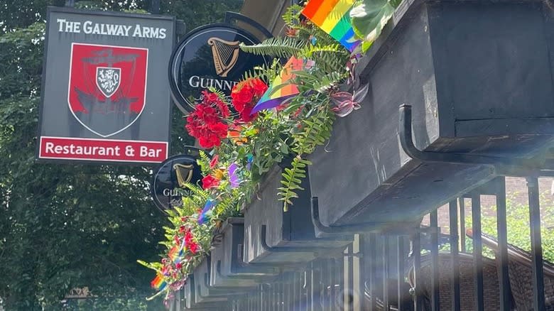 Bar sign and flowers