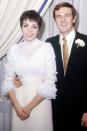 <p>For her first wedding to Peter Allen, Liza Minnelli wore all a white dress ensemble, but with her own flair. The lace blouse with ruffled sleeves and a turtleneck, paired with a sleek cream skirt, was ahead of its time.</p>