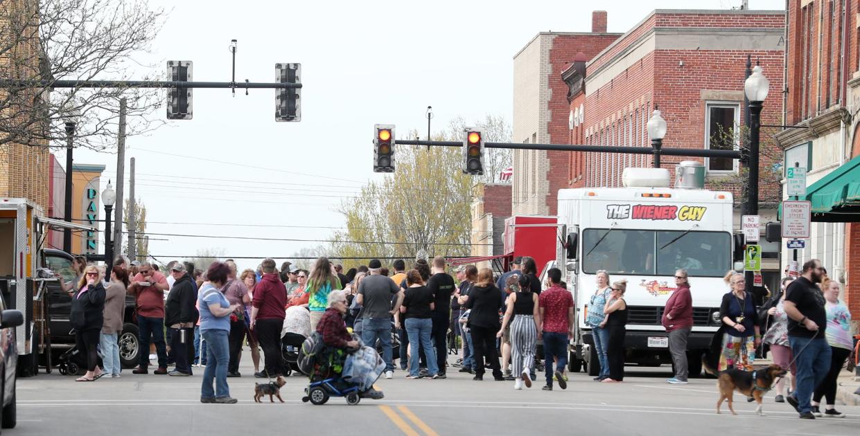 Crowds wait at food trucks at the Ravenna Jo-Jo Festival Friday. Attendees could purchase a punch card for $5 to sample jojos from every vendor.