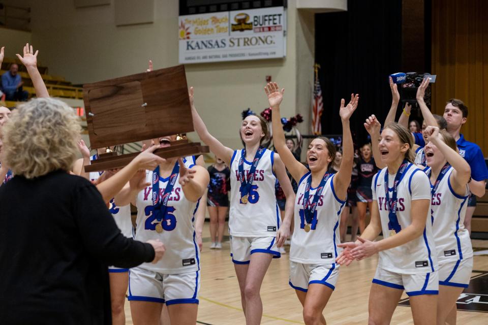 Seaman girls basketball celebrate after winning the Class 5A State Championship on Saturday, March 9.