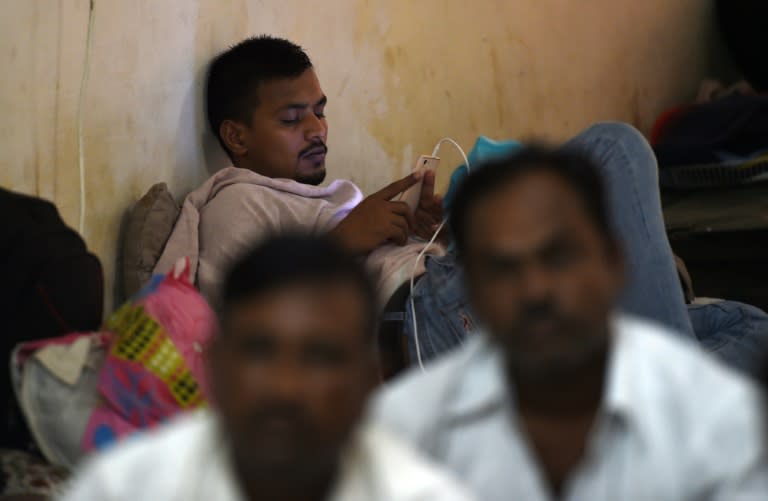 Indian workers from Bihar state gather in a hotel in New Delhi, after they were repatriated by the Indian government from Saudi Arabia