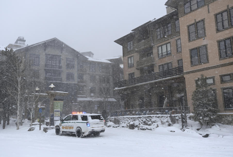 Placer County sheriff vehicle is parked outside The Village at Palisades Tahoe on Wednesday, Jan. 10, 2024, in Tahoe, Calif. (AP Photo/Andy Barron)