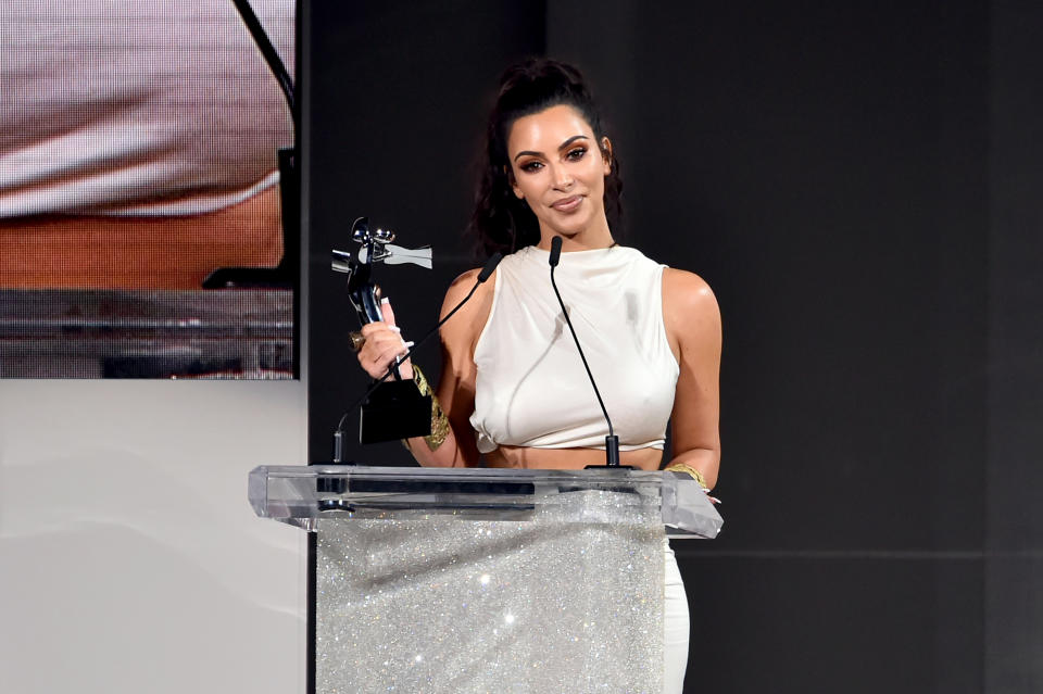 Kim Kardashian accepted her Influencer award at the CFDA’s annual awards [Photo: Getty]