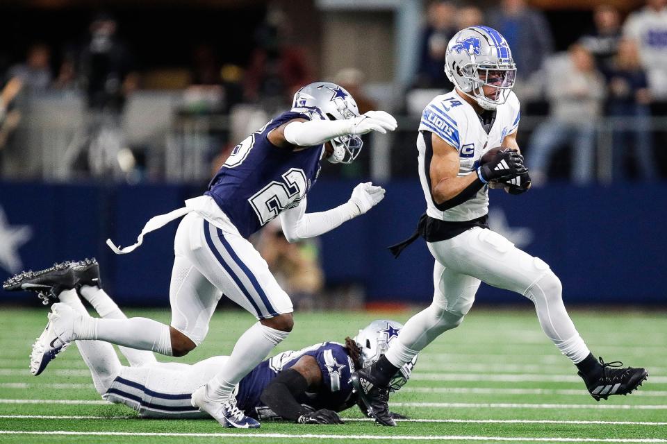 Lions wide receiver Amon-Ra St. Brown runs against Cowboys cornerback DaRon Bland during the first half at AT&T Stadium in Arlington, Texas on Saturday, Dec. 30, 2023.