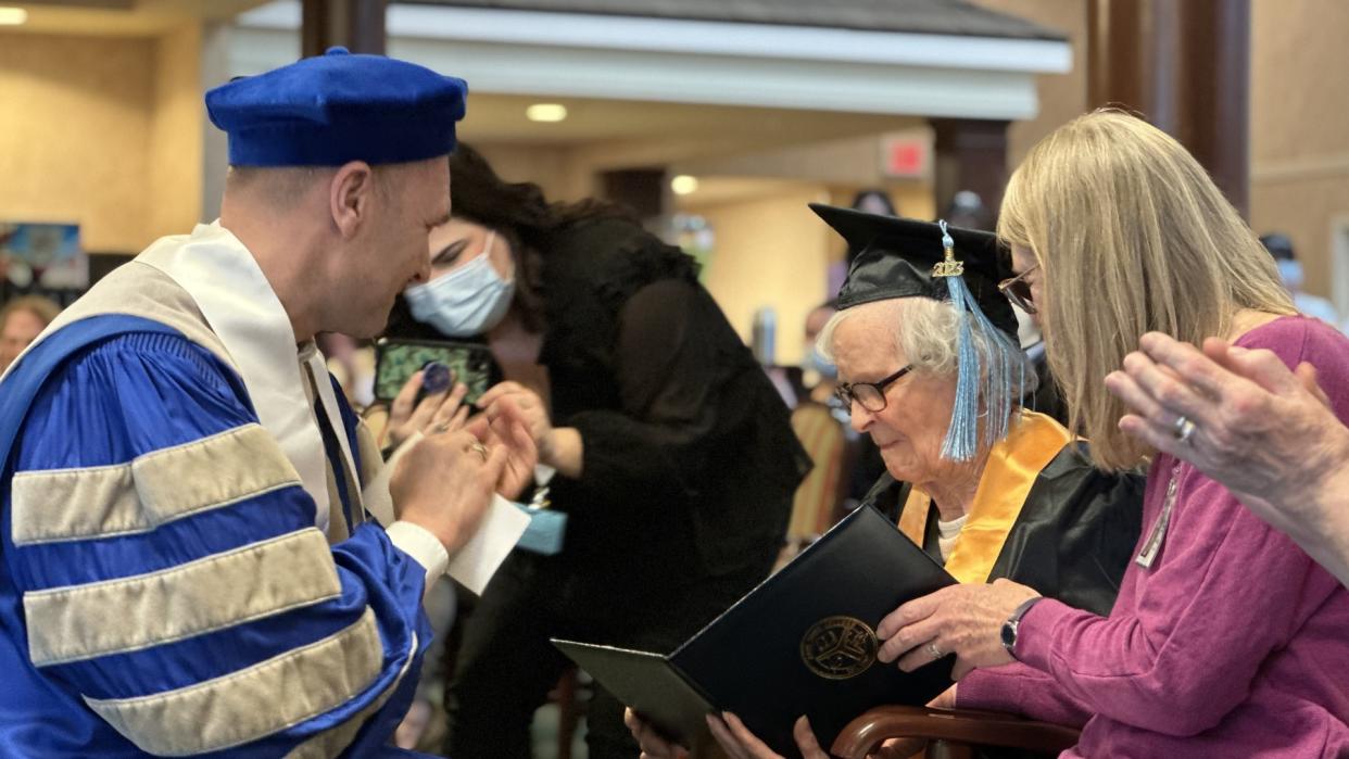 Nancy Power Hodous, 102, receiving an honorary associates degree from Zane State College after finally completing her college courses. (Credit: Trilogy Health Services) 