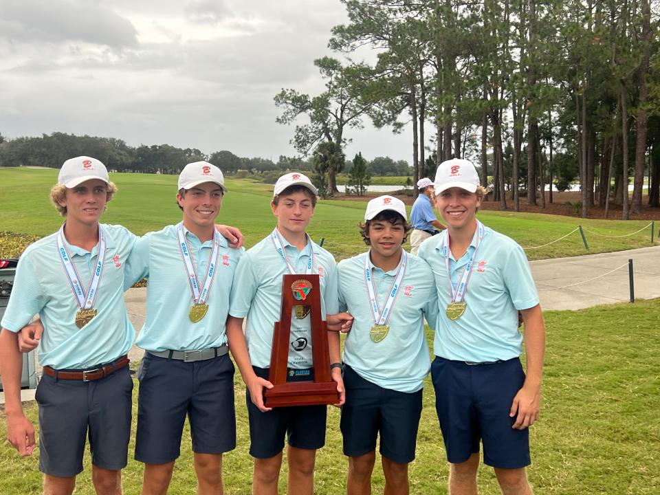 From left, Brooks Colton, Pavel Tsar, Jake Valentine, Charlie Woods and Tyler Bruneau snap a pic Wednesday with the Benjamin boys golf’s fourth state championship trophy in program history at Mission Inn Resort and Club.