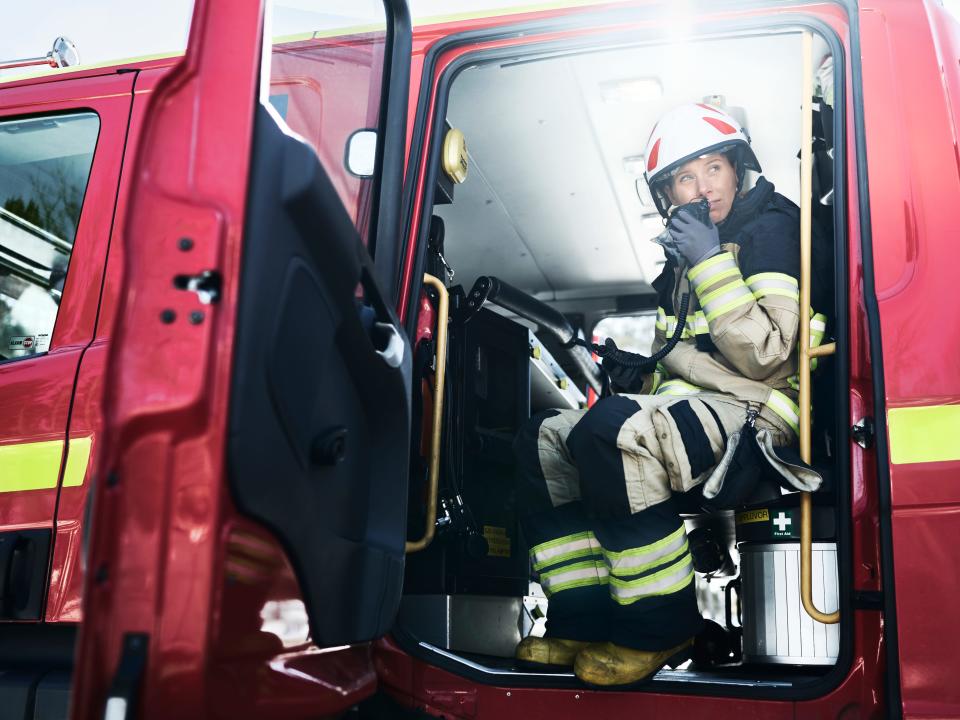 A firefighter in a firetruck