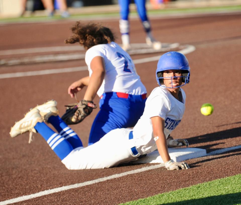 Savana Gonzales slides safely into third base against Coleman on May 5.