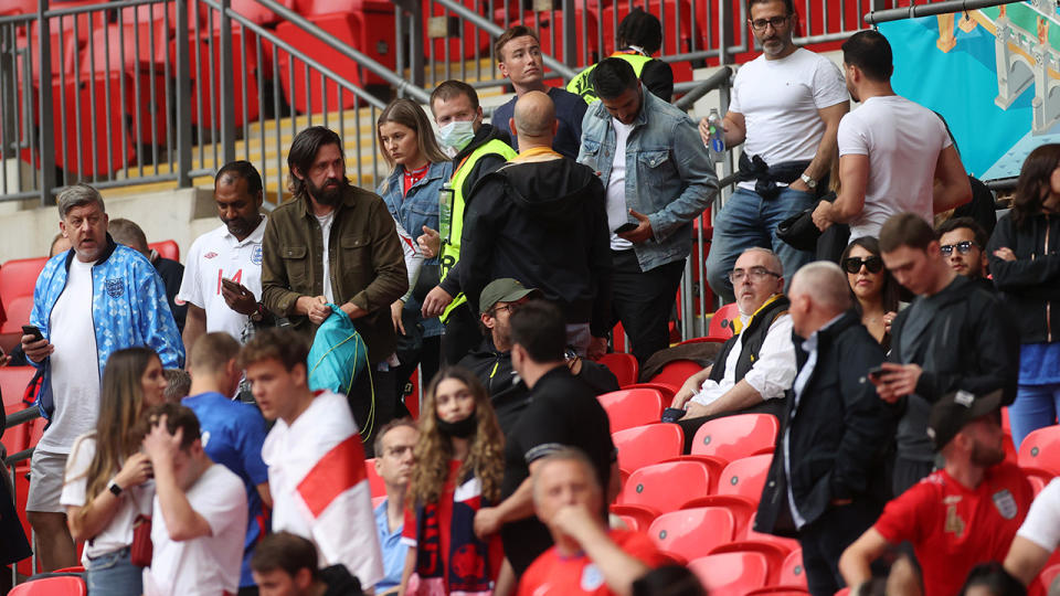 Stadium security, pictured here checking tickets as fans take their seats inside Wembley Stadium. 