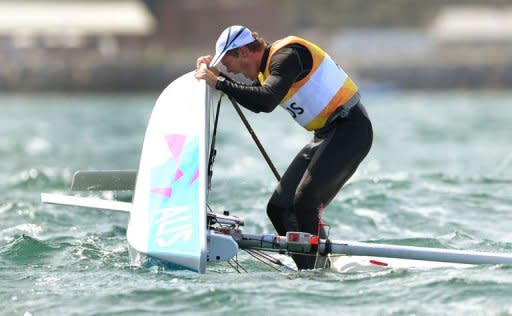 Australia's Tom Slingsby celebrates winning gold in the Laser sailing class at the London 2012 Olympic Games, in Weymouth