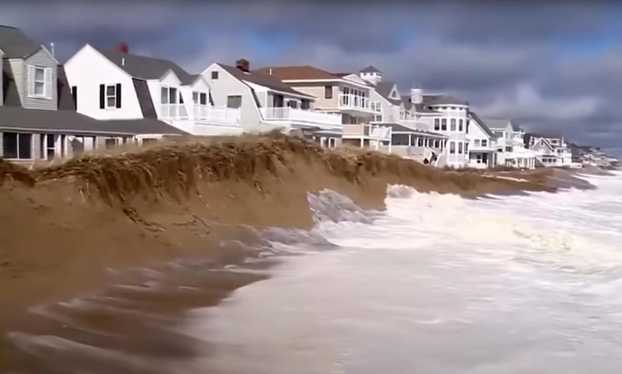 <span>A sand dune erected to protect homes in Salisbury, Massachusetts, washed away in three days.</span><span>Photograph: WCVB Channel 5 Boston</span>