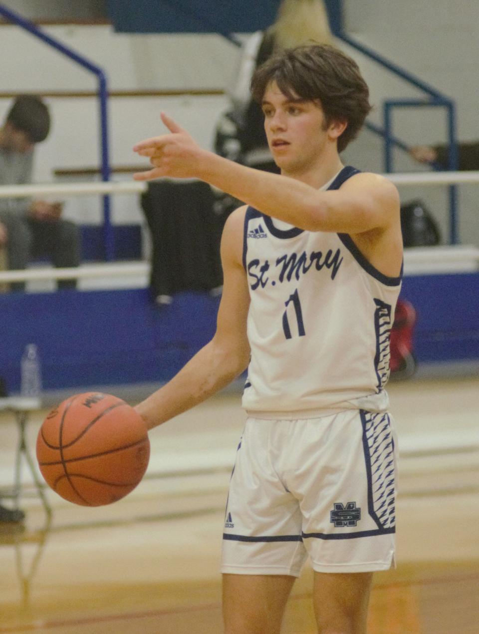 Gavin Bebble sets up the offense during a boys basketball matchup between Gaylord St. Mary's and Bellaire on Tuesday, February 7/