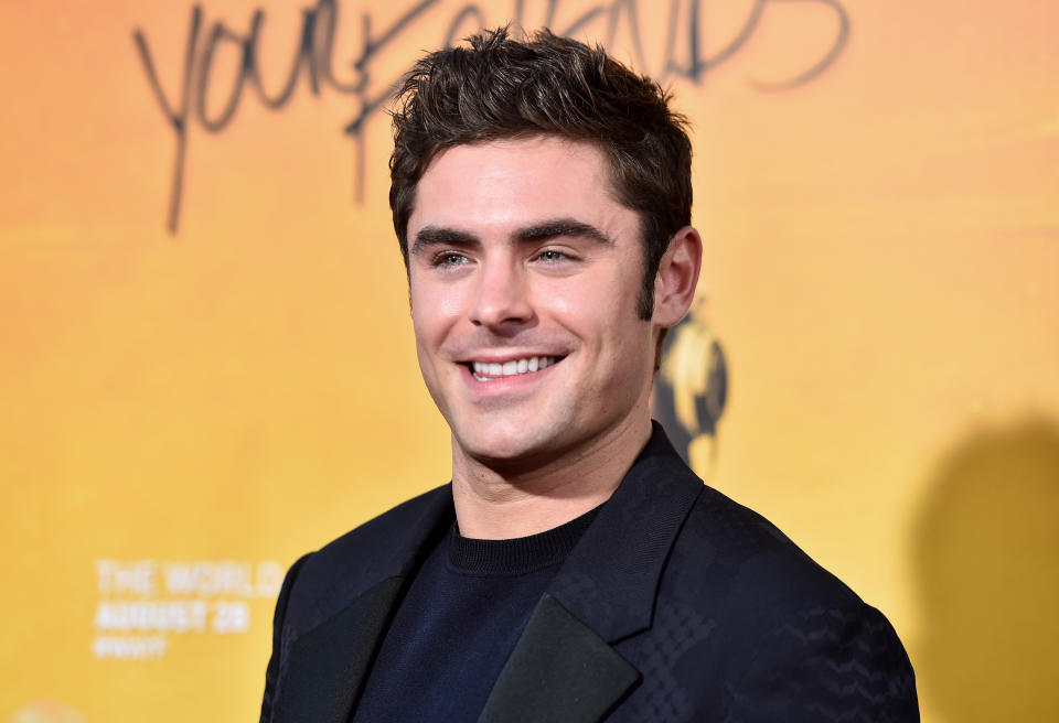 A younger  Zac Efron smiling