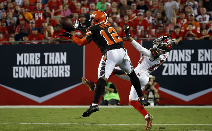 Aug 26, 2016; Tampa, FL, USA; Cleveland Browns wide receiver Josh Gordon (12) catches the ball for a touchdown as Tampa Bay Buccaneers defensive back Brent Grimes (24) misses the tackle during the first half at Raymond James Stadium. Mandatory Credit: Kim Klement-USA TODAY Sports