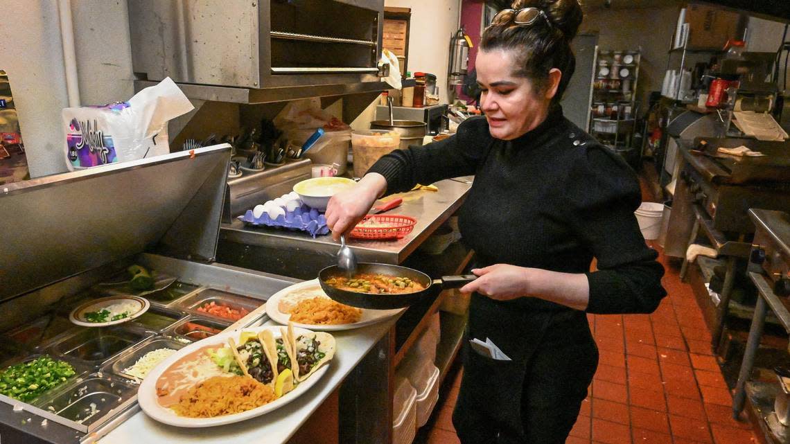 Flora Cortez, owner of Rosy’s Mexican Restaurant on E Kings Canyon Road, prepares lunch for customers on Tuesday, Feb. 28, 2023.