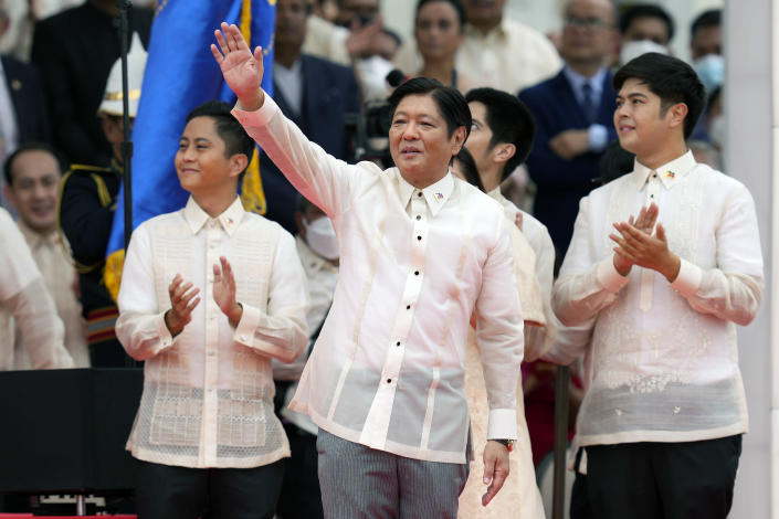President Ferdinand "Bongbong" Marcos Jr., center, greet after being sworn in by Supreme Court Chief Justice Alexander Gesmundo during the inauguration ceremony at National Museum on Thursday, June 30, 2022 in Manila, Philippines. Marcos was sworn in as the country's 17th president. (AP Photo/Aaron Favila)
