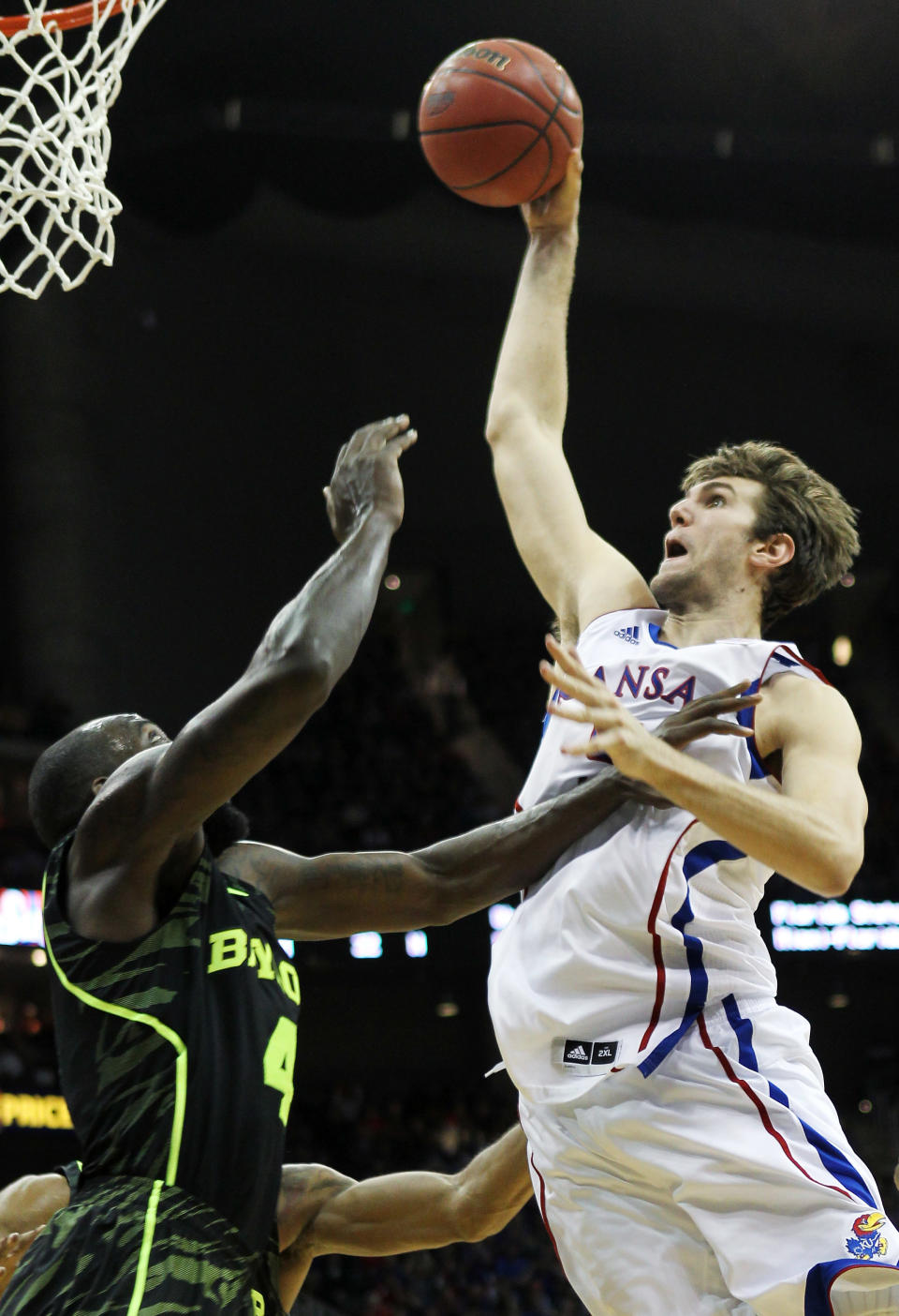 KANSAS CITY, MO - MARCH 09: Jeff Withey #5 of the Kansas Jayhawks goes up for a dunk over Quincy Acy #4 of the Baylor Bears in the second half during the semifinals of the 2012 Big 12 Men's Basketball Tournament at Sprint Center on March 9, 2012 in Kansas City, Missouri. (Photo by Jamie Squire/Getty Images)