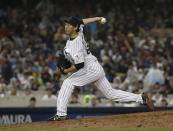 Japan's Yoshihisa Hirano throws during the ninth inning of a semifinal in the World Baseball Classic against the United States, in Los Angeles, Tuesday, March 21, 2017. (AP Photo/Chris Carlson)