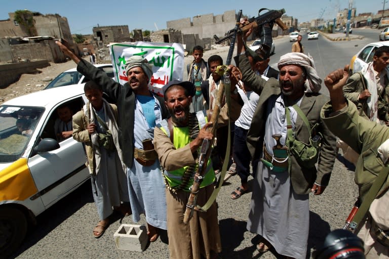 Yemeni rebels shout slogans after overrunning Sanaa on September 21, 2014