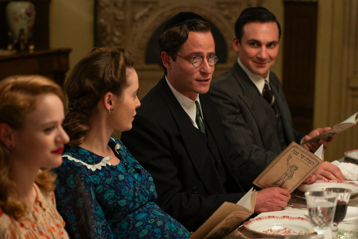 We Were the Lucky Ones -- “Radom” - Episode 101 -- The Kurc family celebrates Passover in Radom, Poland. One year later, the onset of World War II forces a devastating separation. Halina (Joey King), Mila (Hadas Yaron), Selim (Michael Aloni) and Genek (Henry Lloyd-Hughes), shown. (Photo by: Vlad Cioplea/Hulu)