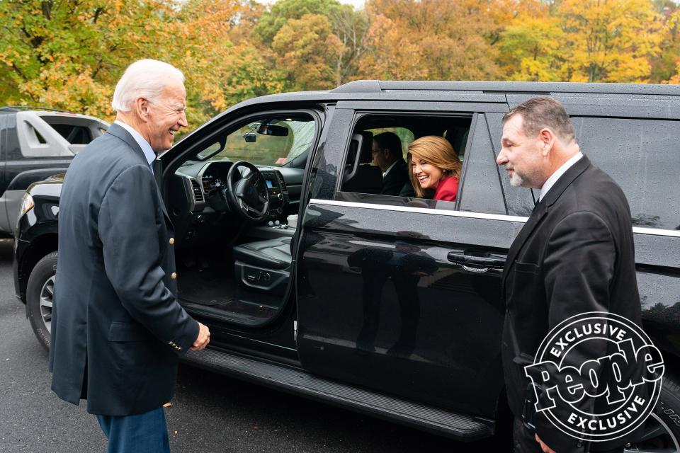 Biden and CBS News' Norah O'Donnell laugh as she departs his home in Wilmington, Delaware, after sitting down for a <em>60 Minutes</em> interview on Oct. 22, 2019.