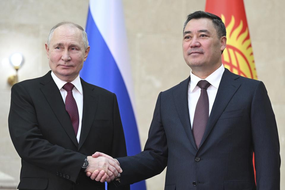 Russian President Vladimir Putin, left, and Kyrgyzstan's President Sadyr Japarov, right, pose for a photo prior to their talks in Bishkek, Kyrgyzstan, Thursday, Oct. 12, 2023. (Dmitry Azarov, Sputnik, Kremlin Pool Photo via AP)