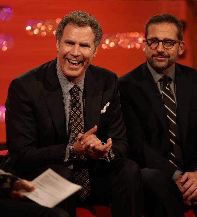 Will Ferrell and Steve Carell sit together on a sofa