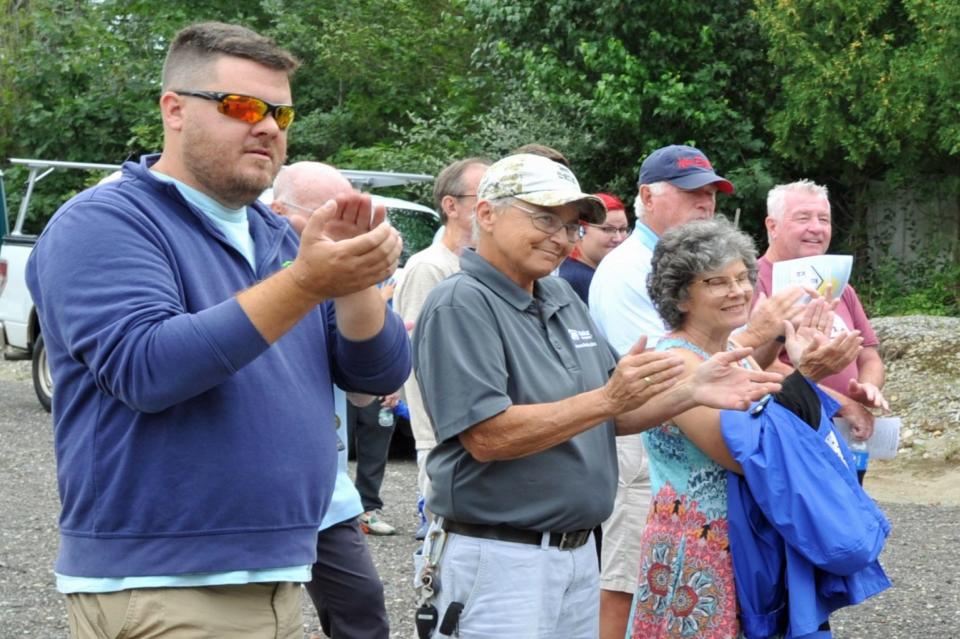Guests applaud during the dedication of two new Habitat for Humanity homes in Hingham, Sunday, Aug. 27, 2023.