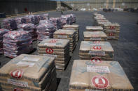 Bags of cement are seen ahead of their transfer to the Gaza Strip, inside the Kerem Shalom border crossing terminal between Israel and Gaza Strip, Israel August 15, 2018. REUTERS/Amir Cohen